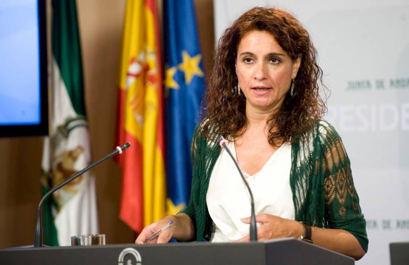 <span style='color:#780948'>ARCHIVED</span> - Spain will fine banks and energy companies if they pass on tax hikes to consumers